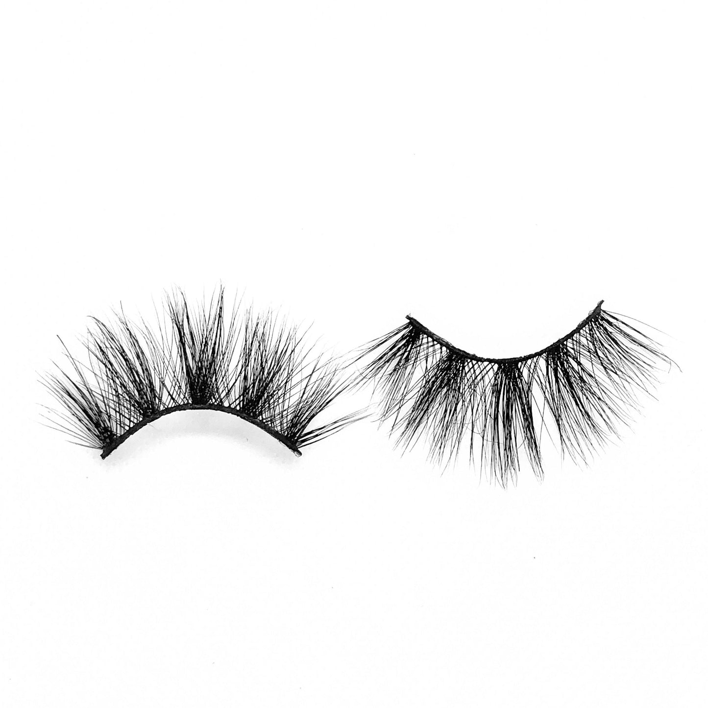 Cardi-Mega Volume-"Cardi” is the more dramatic, longer version of our “Serenity” lashes. These long, 25mm, 5D mink lashes give a dramatic wispy look. Super cute, girly, and flirty. These lashes can be styled for so many different occasions. Also available in our "Alpha Femme (3-Pack)." Try our "Serenity" lashes for a shorter look! Description Handmade, Cruelty-Free, Wear up to 30x Material: 100% Mink Band: Black Cotton Band Volume: Mega Volume Style: Dramatic, X-Long, Wispy, Open-eye To Use: Mea
